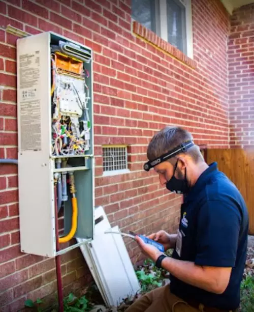 Tech Installing Tankless Water Heater